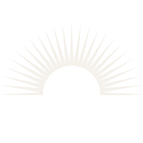 Silhouette of a setting sun with rays radiating outward on a black background.
