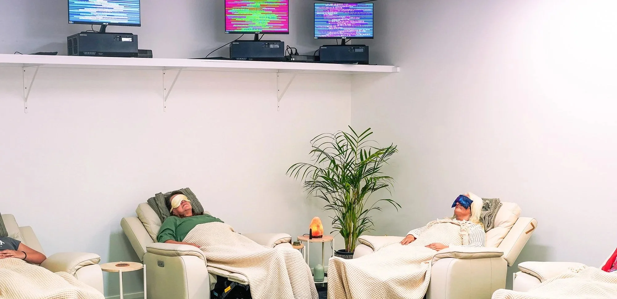 Women laying in a recliner enjoying a Soulibrium Meditation Session in The Scalar Room