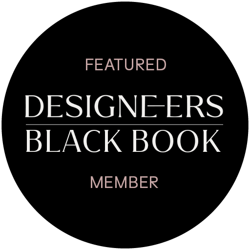 Black background with pink and white text reading "FEATURED DESIGNERS BLACK BOOK MEMBER".