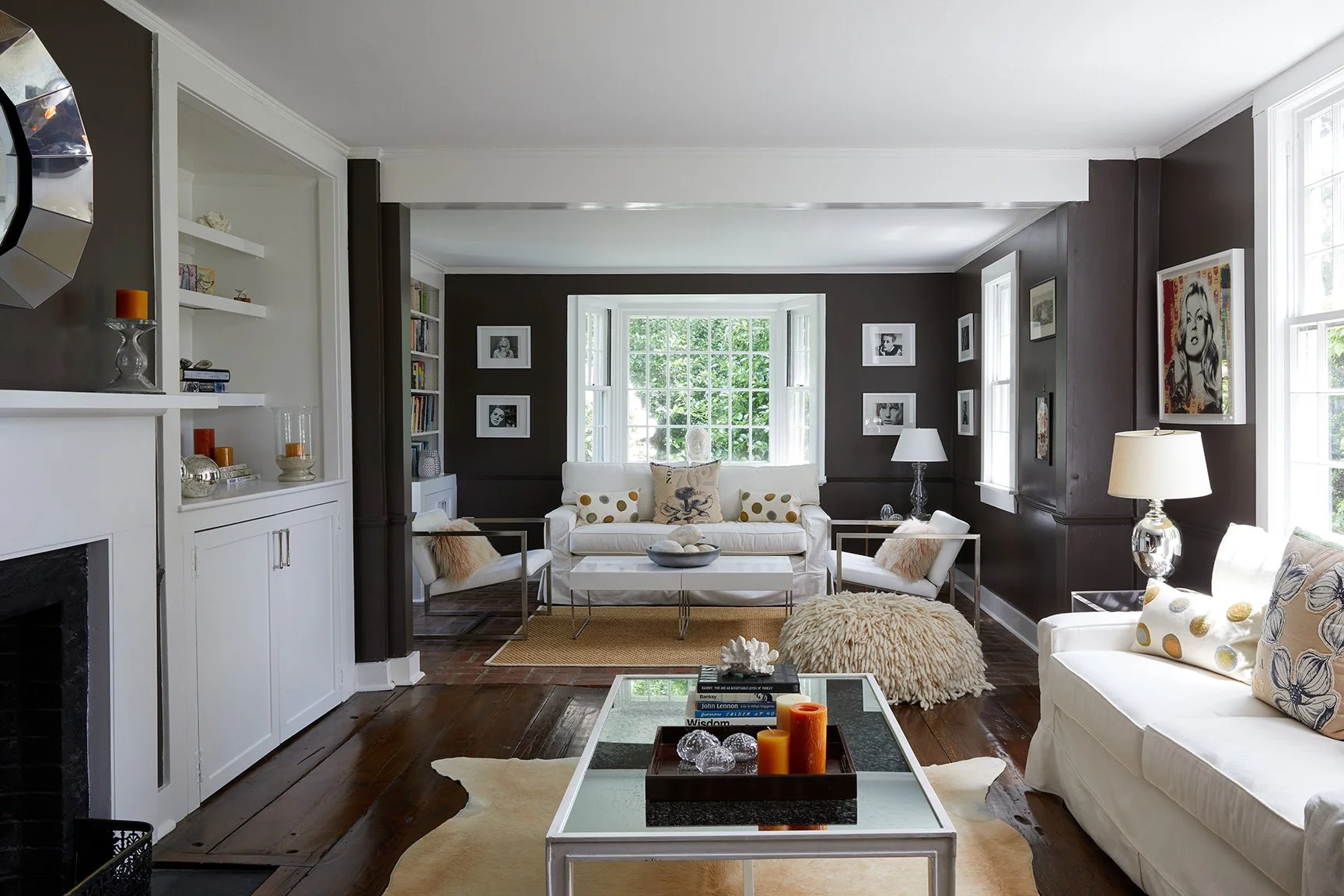 Living room with deep brown walls, white sofas, gallery wall, vintage accessories, and layered rugs in a Darien CT farmhouse renovation by Ginger Lemon Indigo