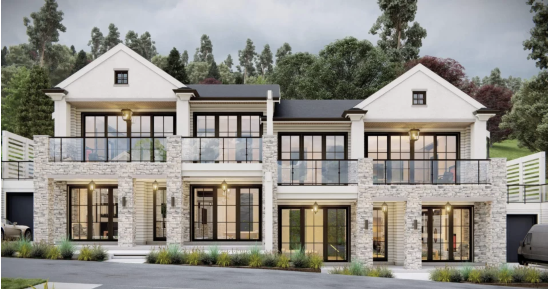 A modern multi-story apartment building with stone and white siding exterior, large glass windows, balconies with black railings, and a landscaped front yard with small plants and street lamps.