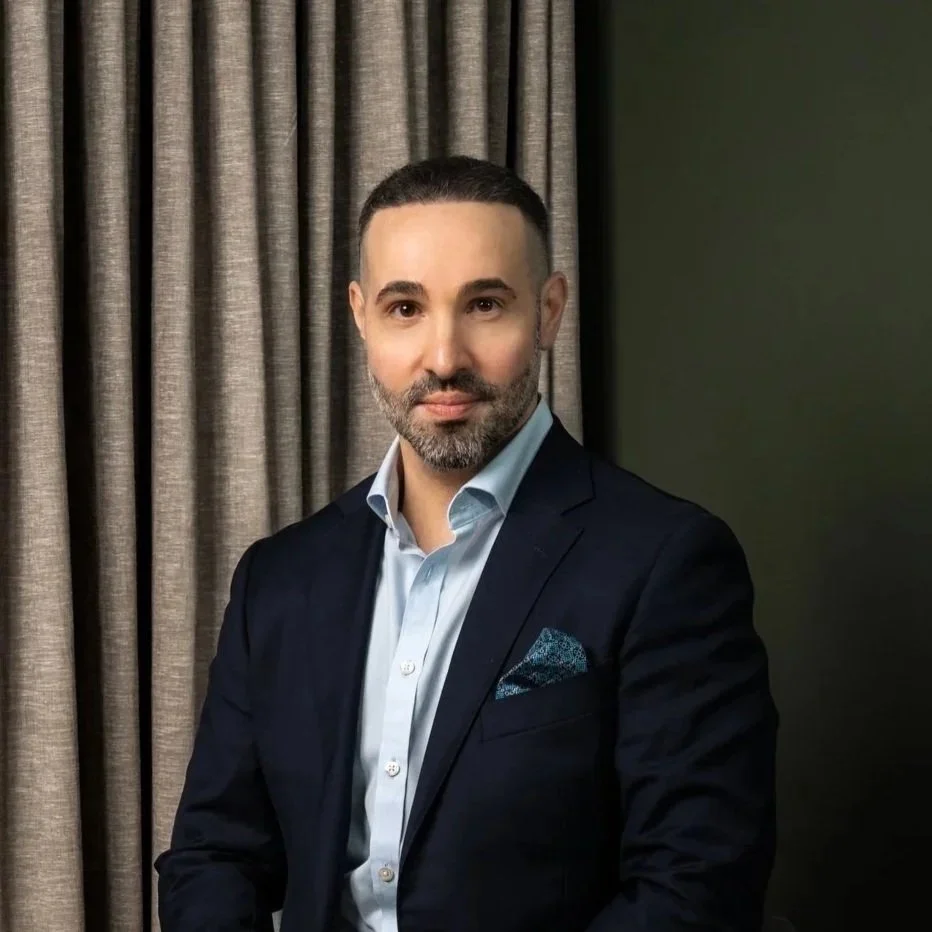 Headshot of smiling director/mortgage broker