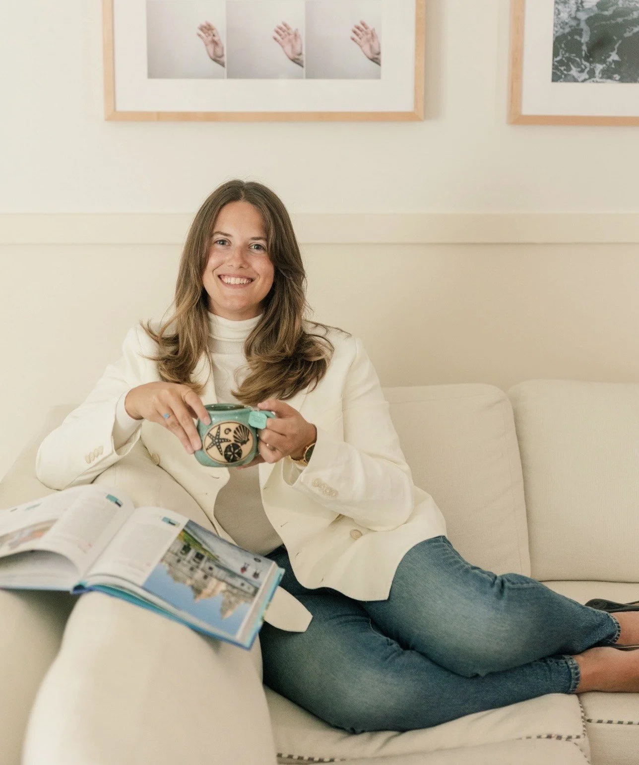 Portrait of a European travel planner sitting with a travel book and tea, reflecting a calm and intentional approach to trip design