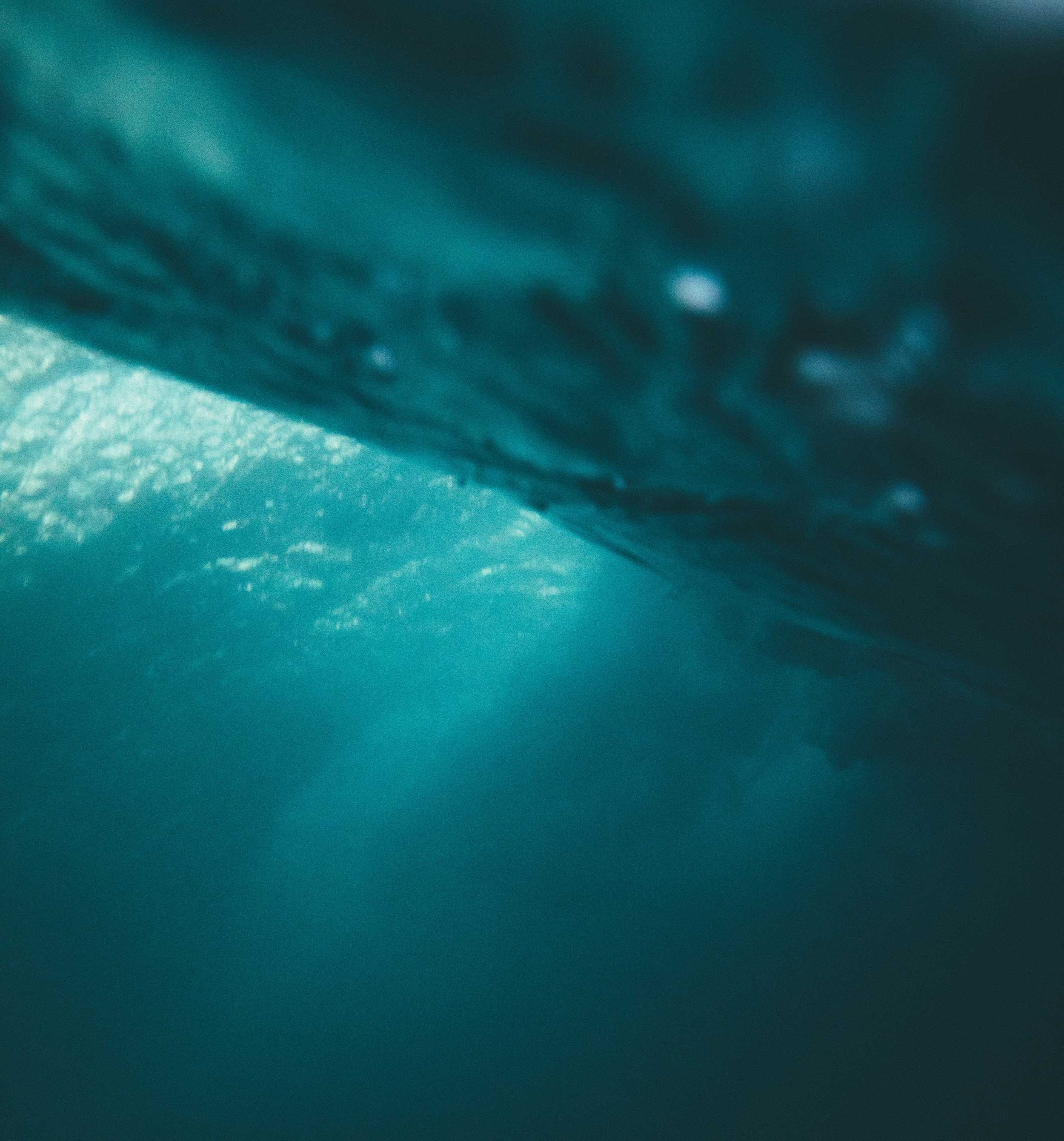Light filtering down through deep water.