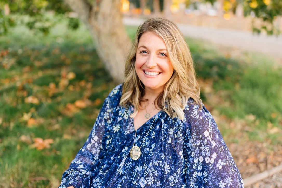 Dr. Lindsay Ulrey smiling brightly while outside