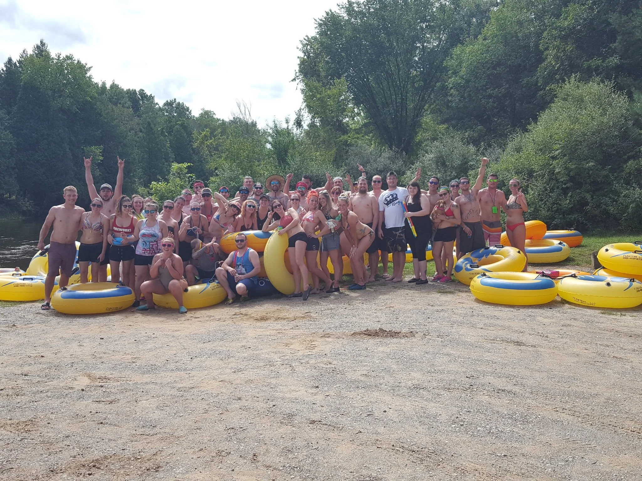 Group of tubers having fun on a Mt. Pleasant, Michigan river float.