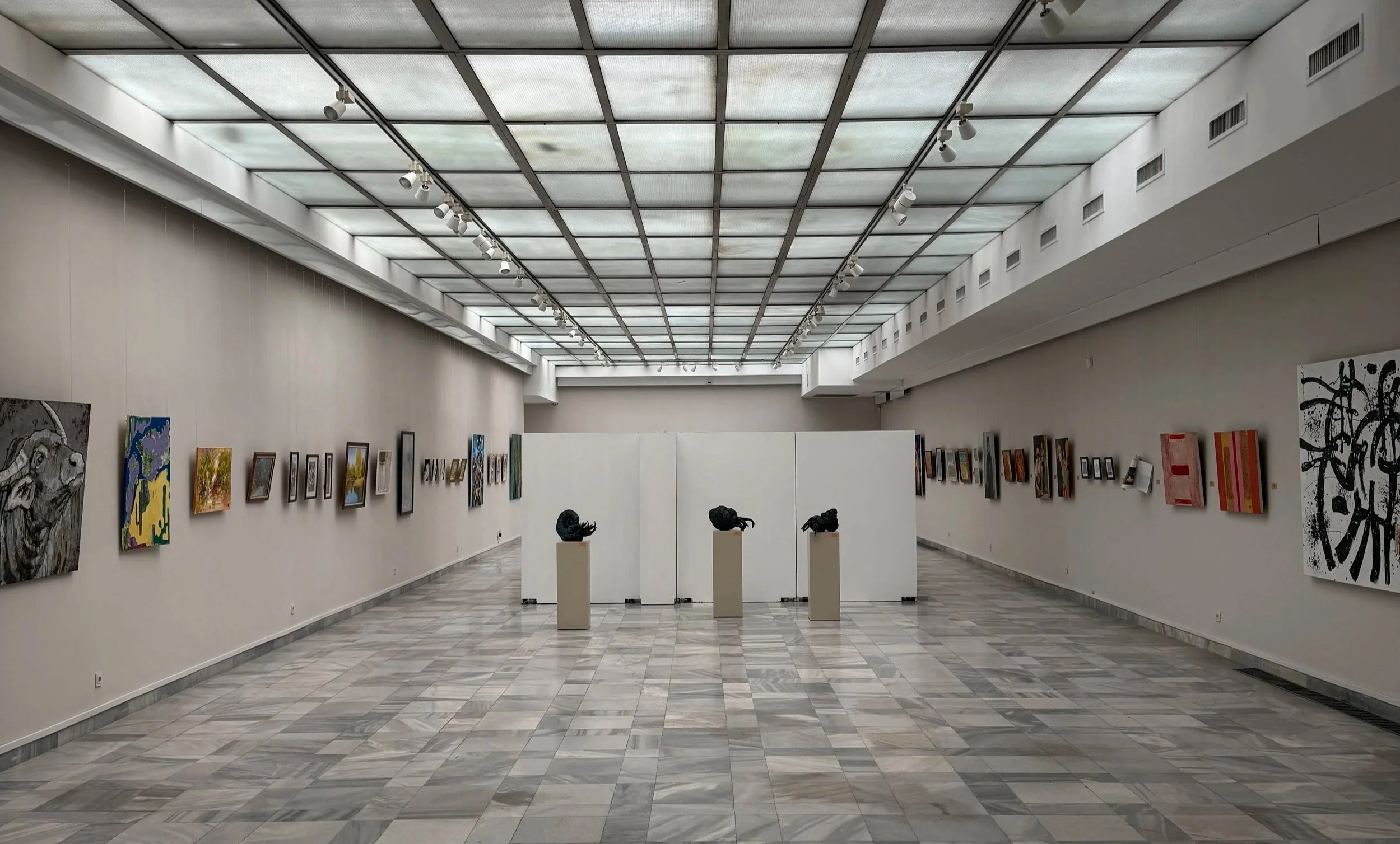 Installation view of the Spring 2026 exhibition at Art Gallery "Vladimir Dimitrov-Maystora", featuring original contemporary artwork by Nicole Bajger displayed on the left wall.