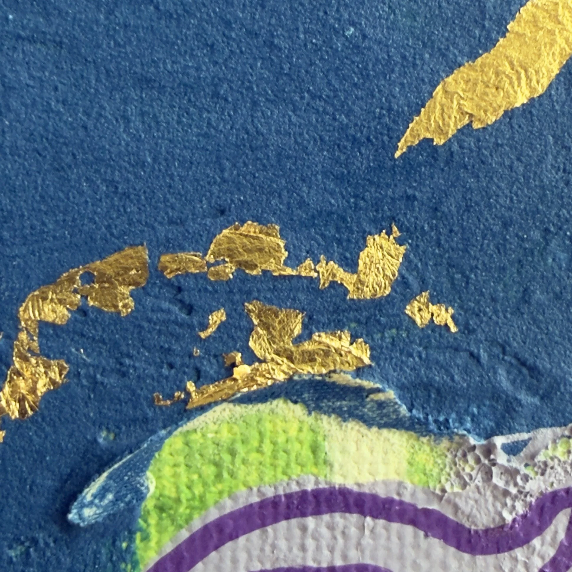 Texture paste, gold leaf specks close up.