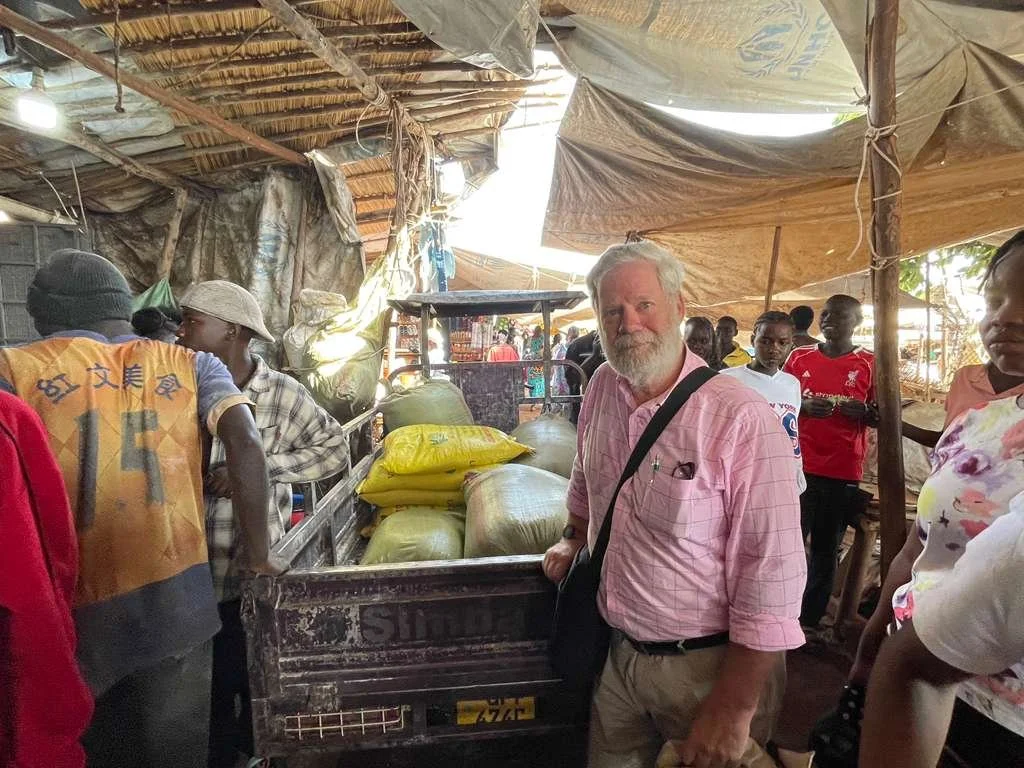 Aran buying food for the refugees.