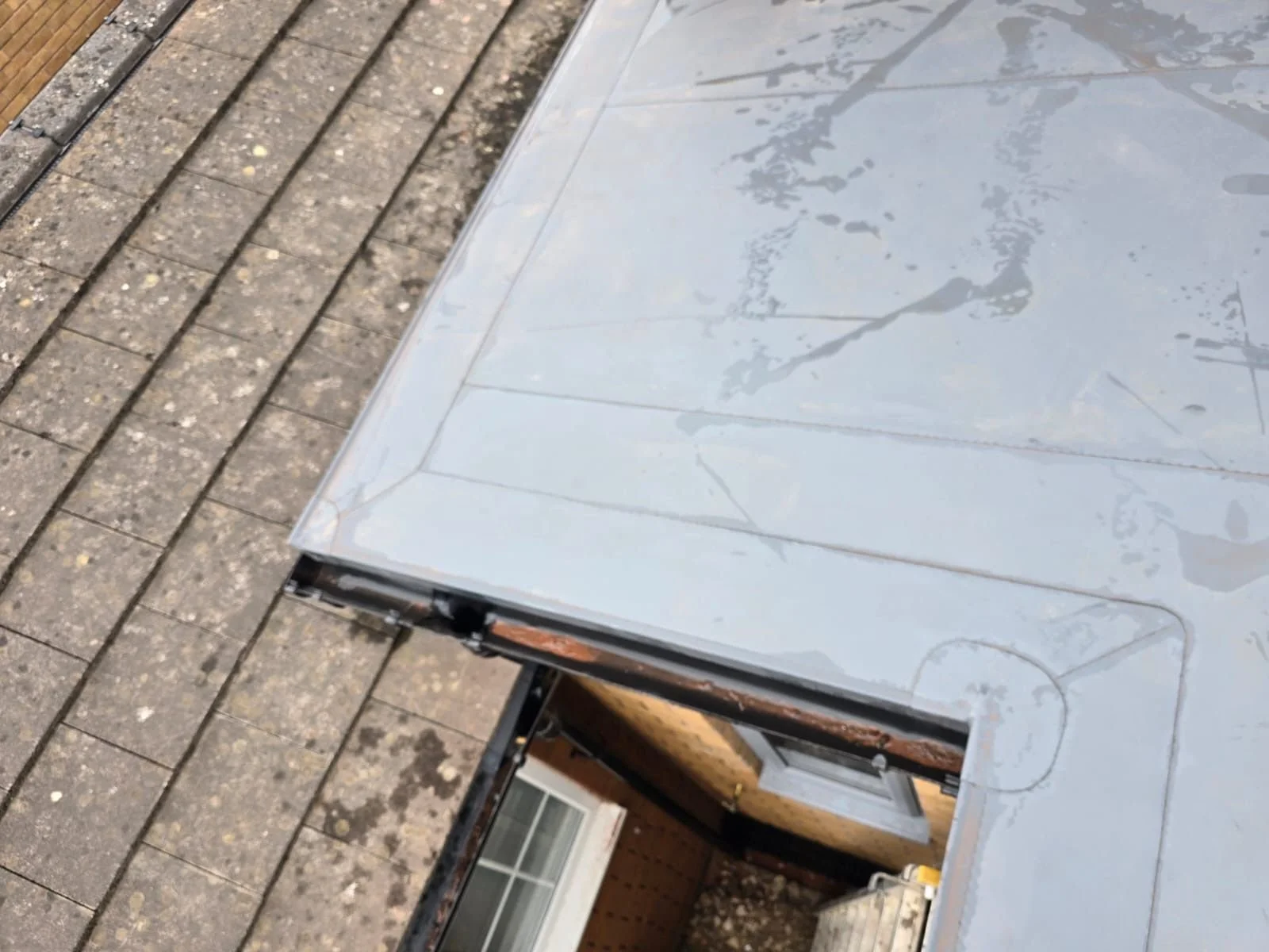 Detail shot of the perimeter trim and edge detailing on a residential roof extension in Carlisle.