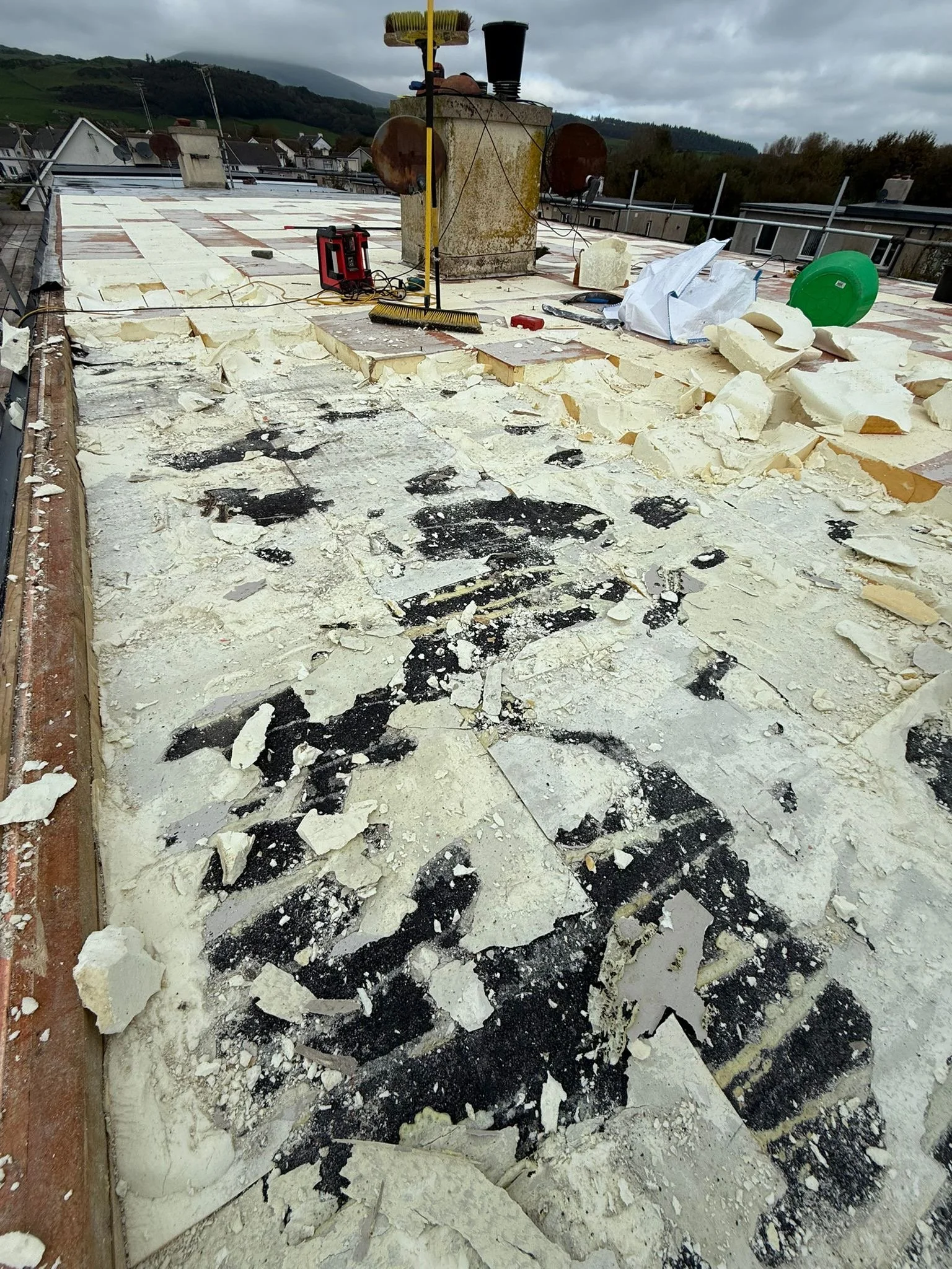 Flat roof restoration in progress, prep work in full swing