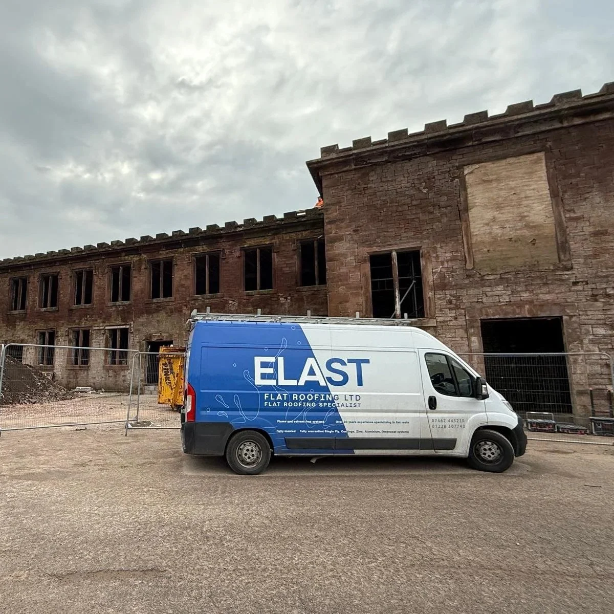 Elast Flat Roofing Ltd van parked outside of the former Kangol factory in West Cumbria during a roof renovation job.