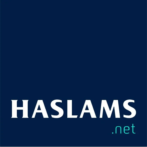 Haslams logo with white text on a dark blue background and light blue suffix
