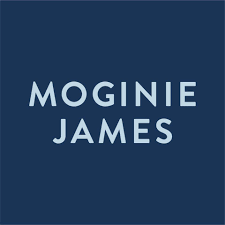 Text-based logo with dark blue background and light blue letters reading 'MOGINIE JAMES'.