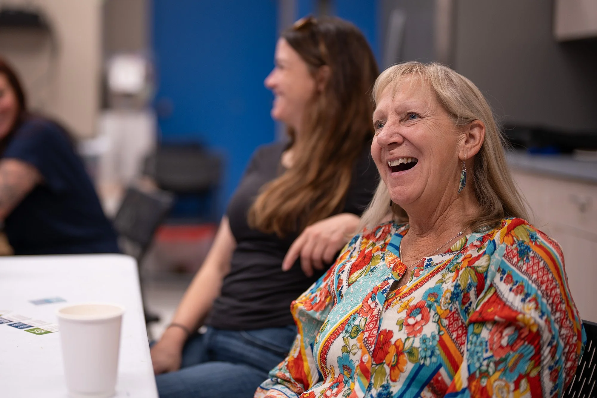 Educators smiling at training