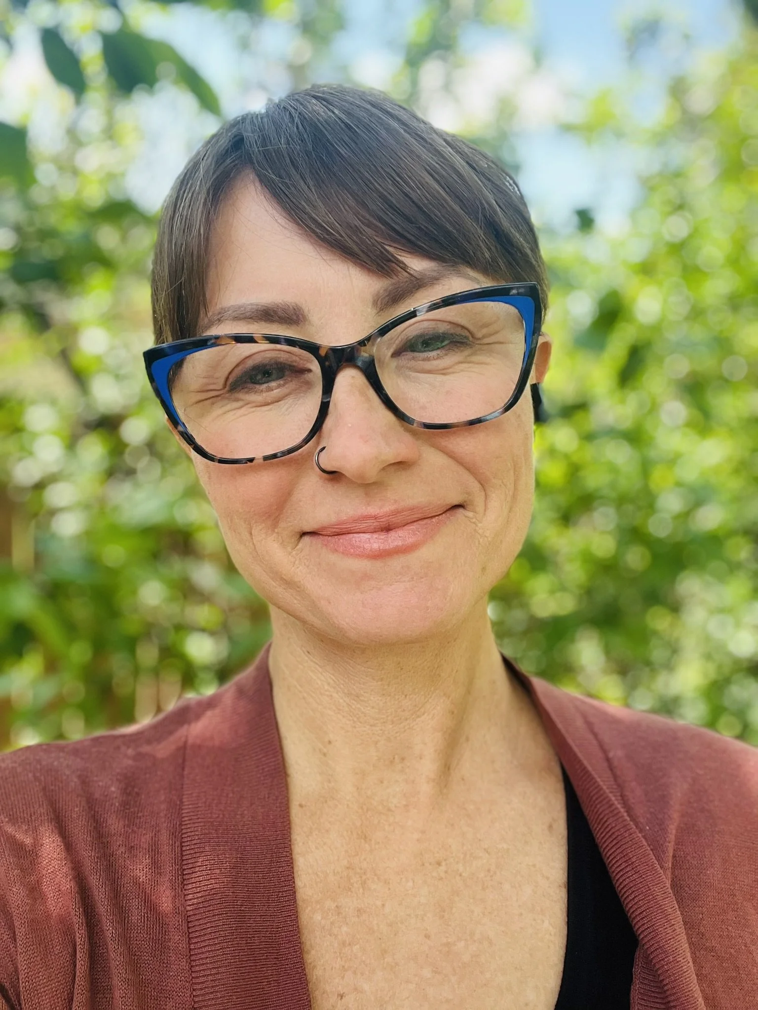Headshot of smiling Earth Force staff member.