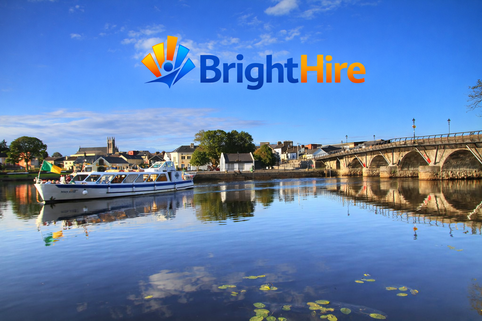 A river with a boat, a bridge, and buildings under a blue sky, with the BrightHire logo at the top.