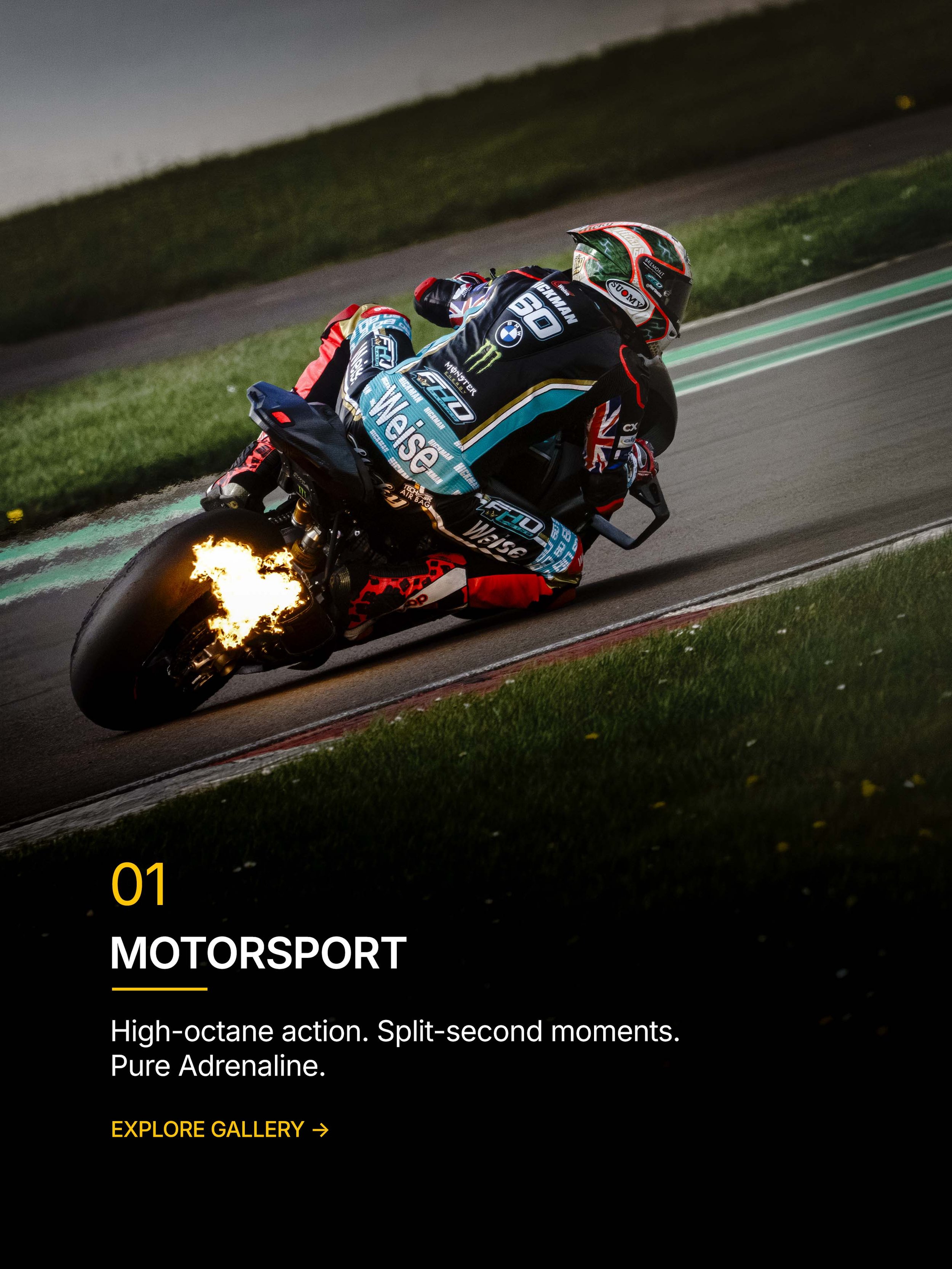 Motorcycle racer cornering with flames from the exhaust.