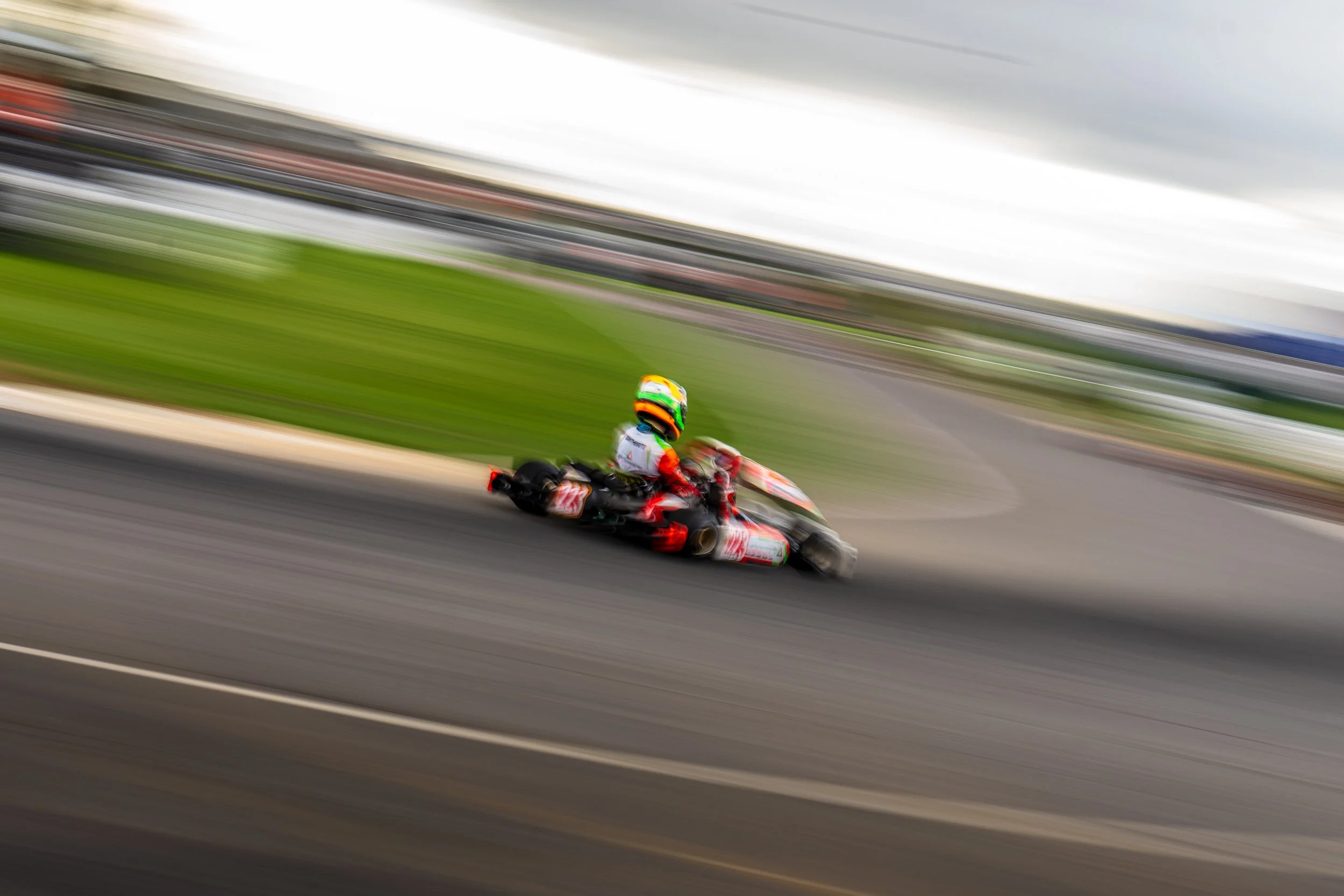 A lone kart racer captured at speed on the Silverstone kart circuit.