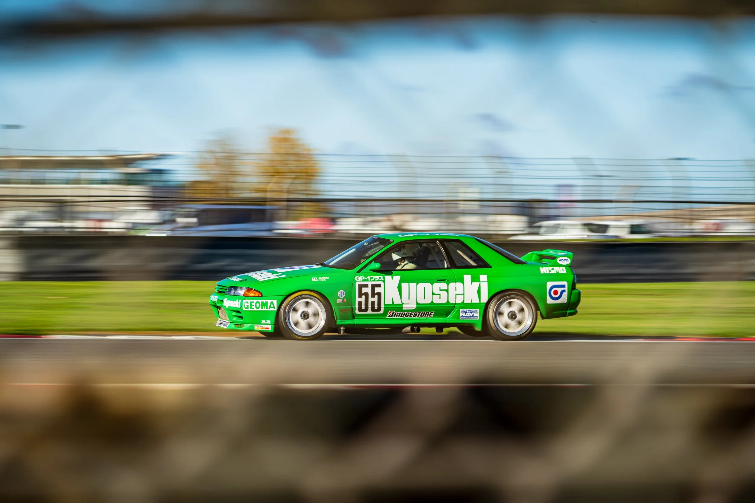 Green touring car number 41 captured in a panning shot at Silverstone.
