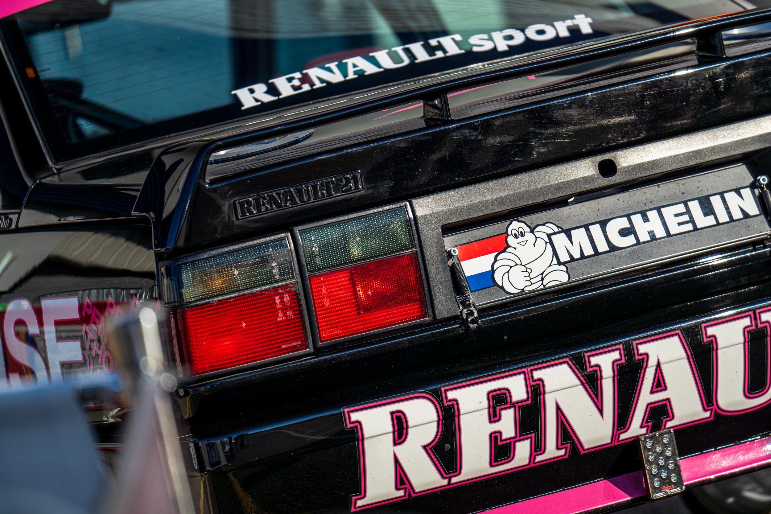 Rear of a Renault racing car with Michelin branding in the Silverstone paddock.