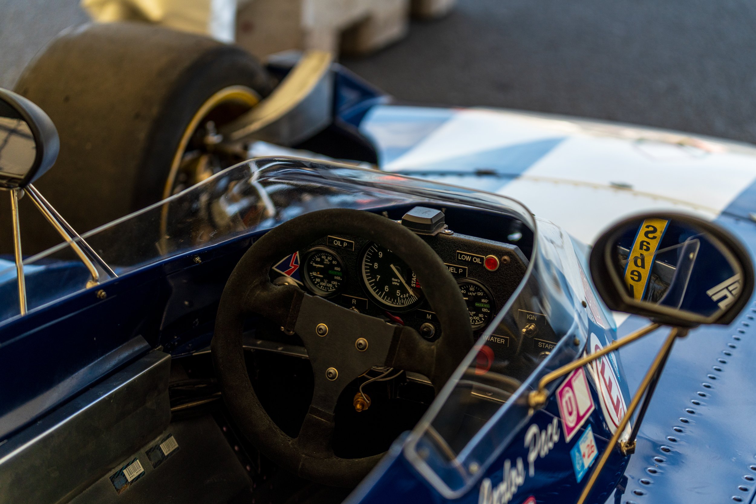 Steering wheel and instruments inside a classic racing car at Donington Historic Festival.