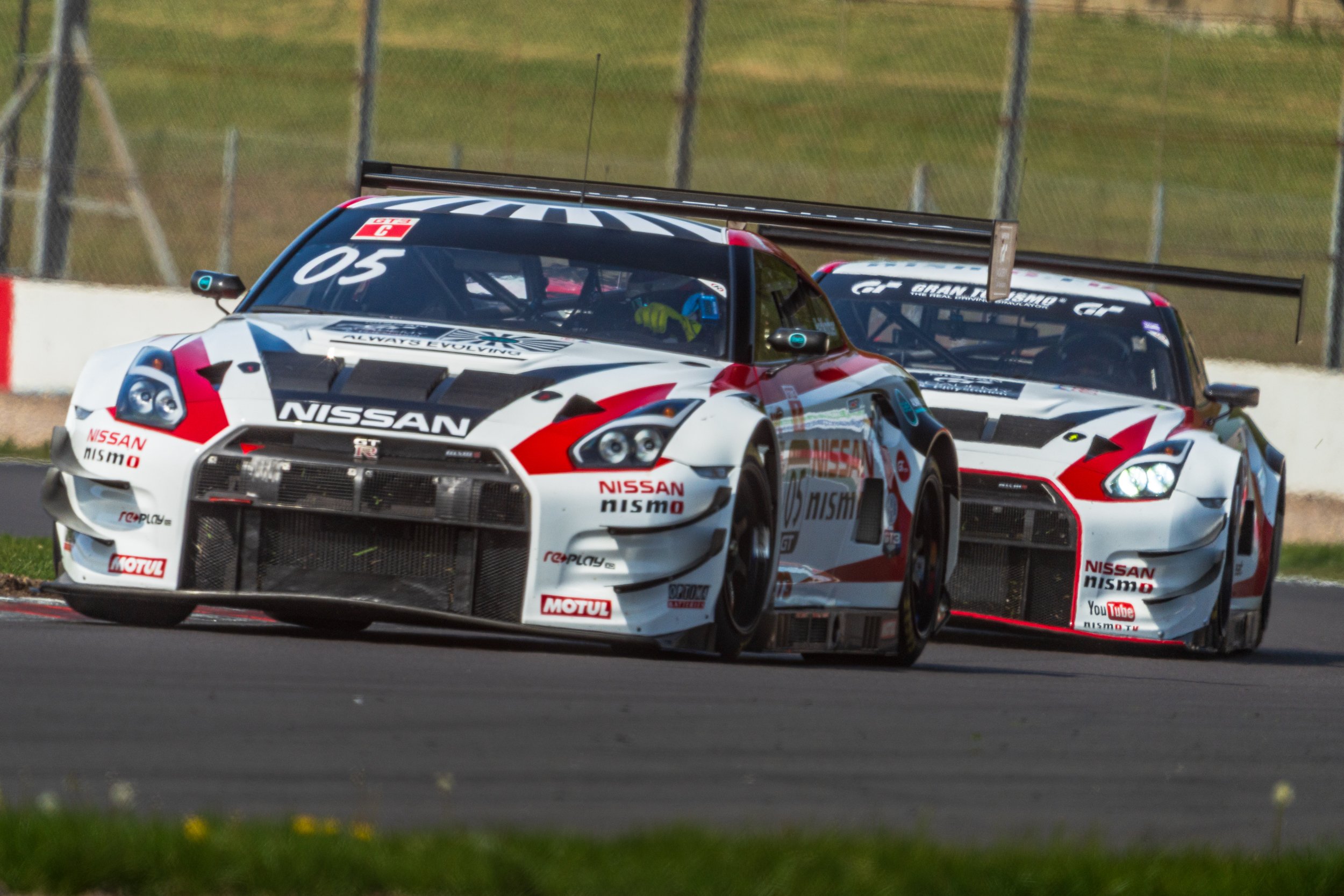 Classic touring cars racing together at Donington Historic Festival.