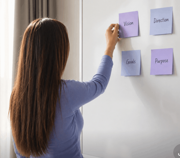 Woman reviewing strategy notes for a Substack coaching session
