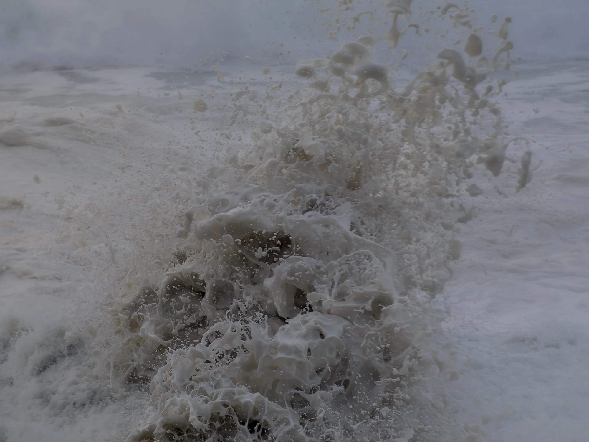 Waves crashing and splashing in the ocean.