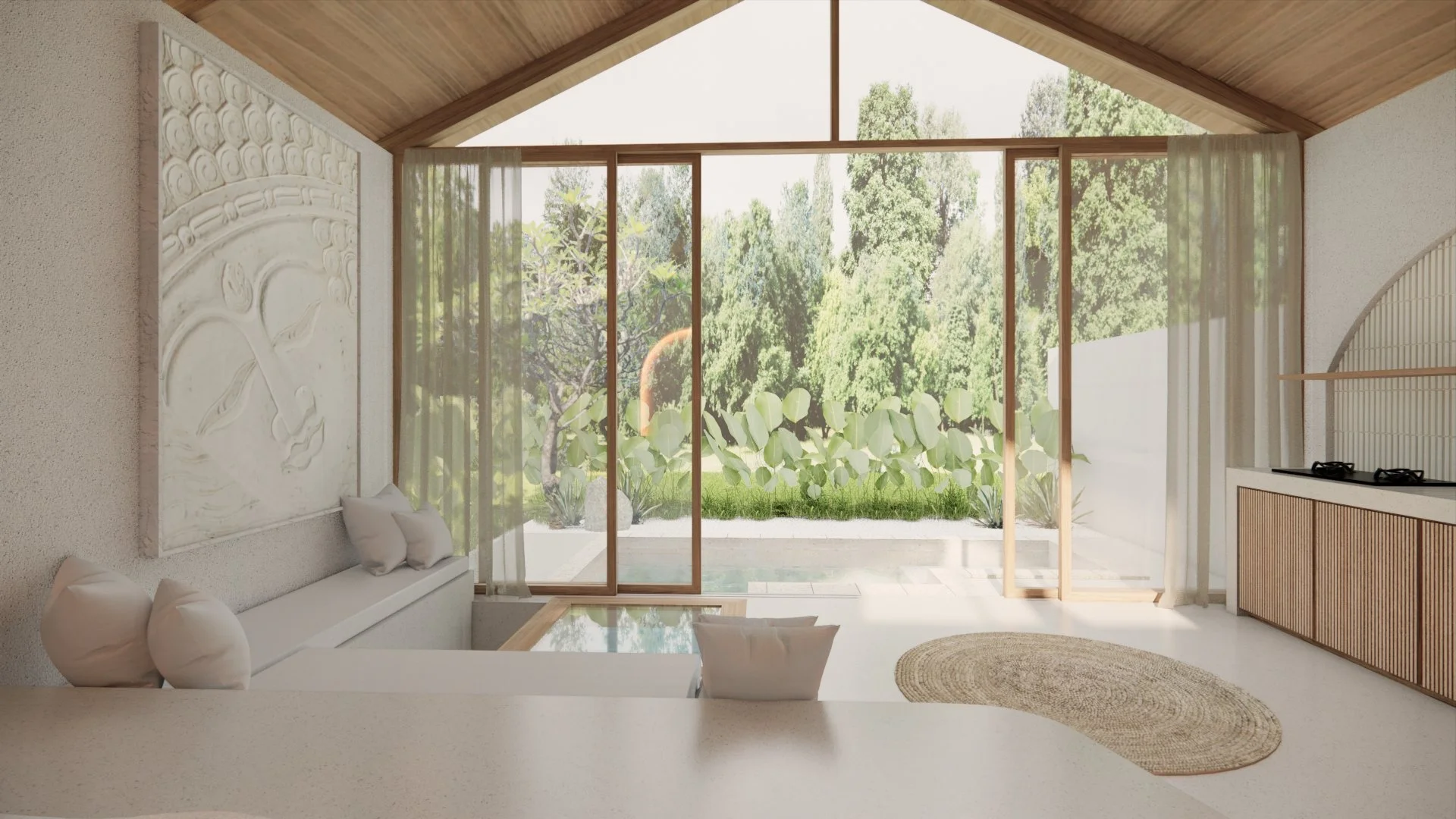 Interior view of a room with large sliding glass doors opening to a garden with trees and greenery, wooden ceiling, decorative wall art, and minimalist furniture.