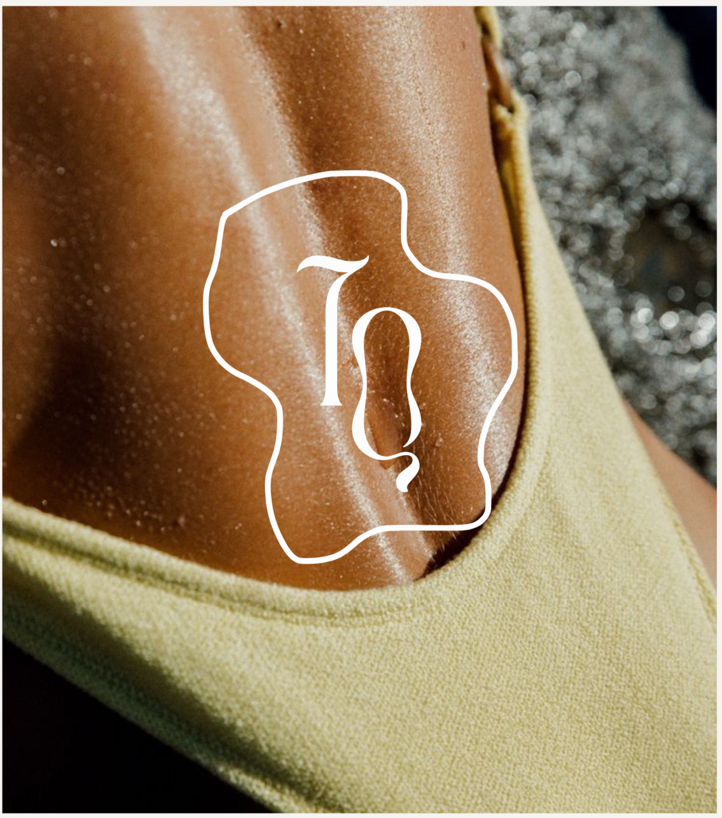 Close-up of a person's nose, showing shiny, dewy skin, partially covered by a yellow shirt with a textured fabric