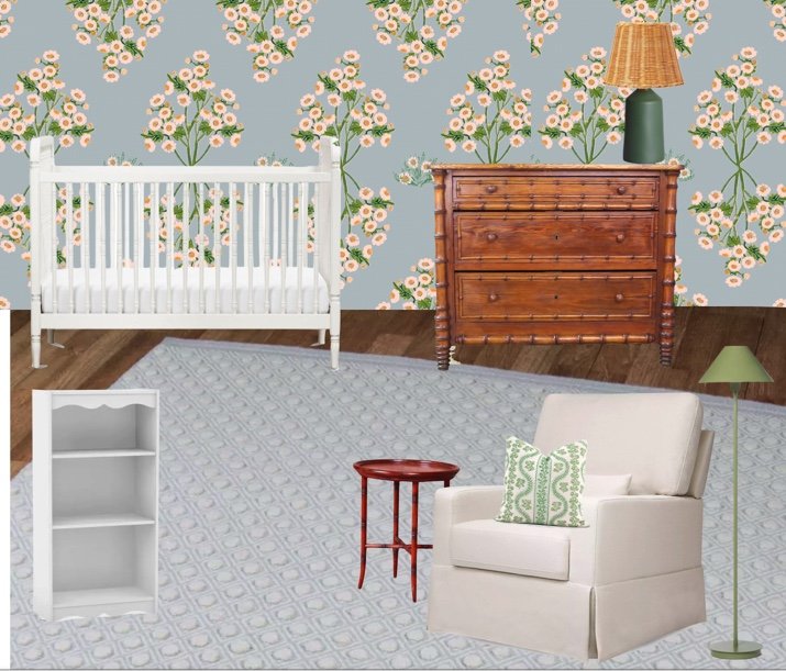 A nursery room with a wallpaper featuring pink flowers and green leaves on a blue background, a white crib, a white armchair with a green patterned pillow, a small wooden side table, a green floor lamp, an antique wooden dresser, a green lampshade, a white bookshelf, and light hardwood floors.