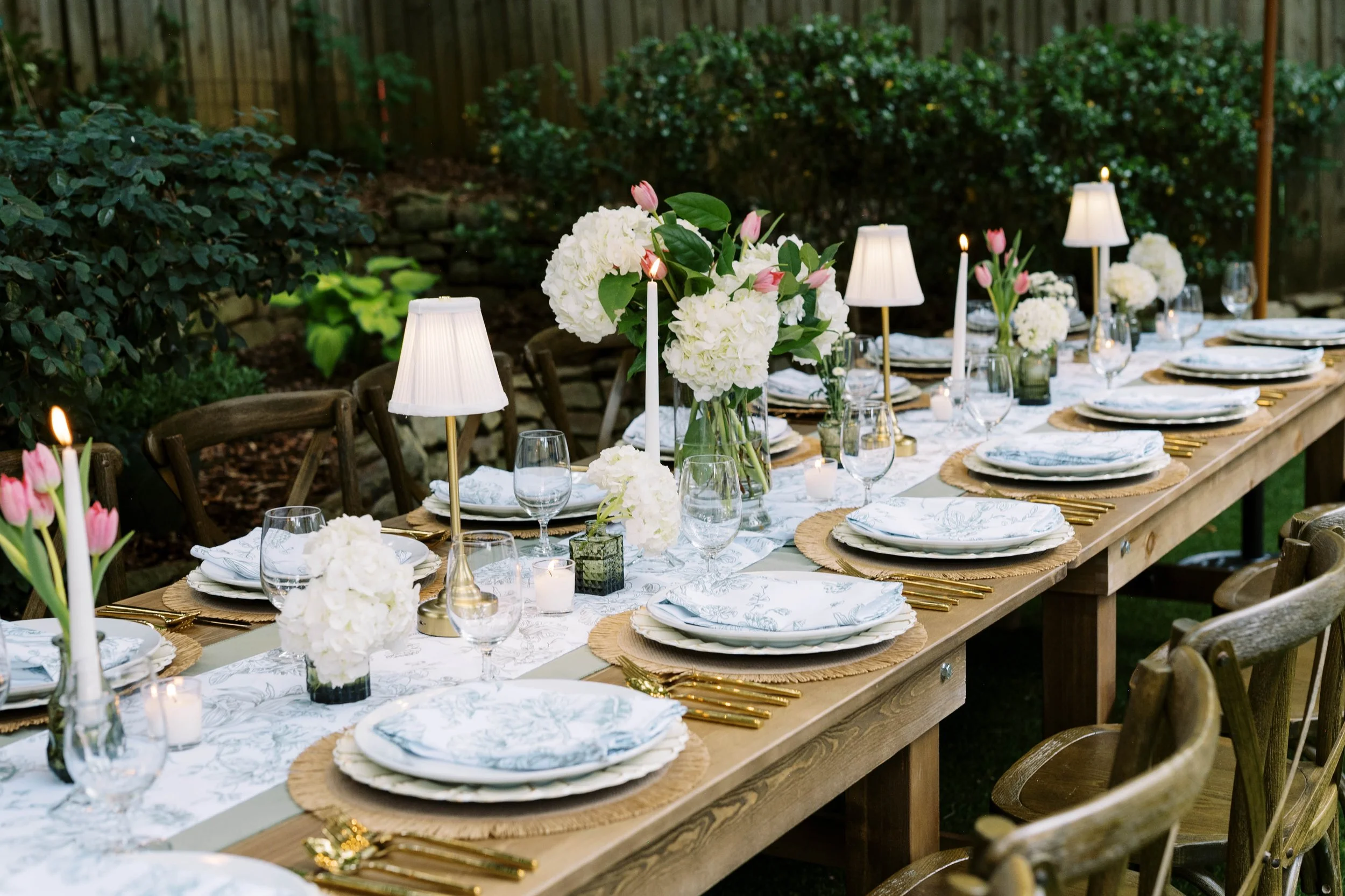 Intimate dinner party setup with farmhouse table and sage green linens — The Gathered Table, Decatur GA