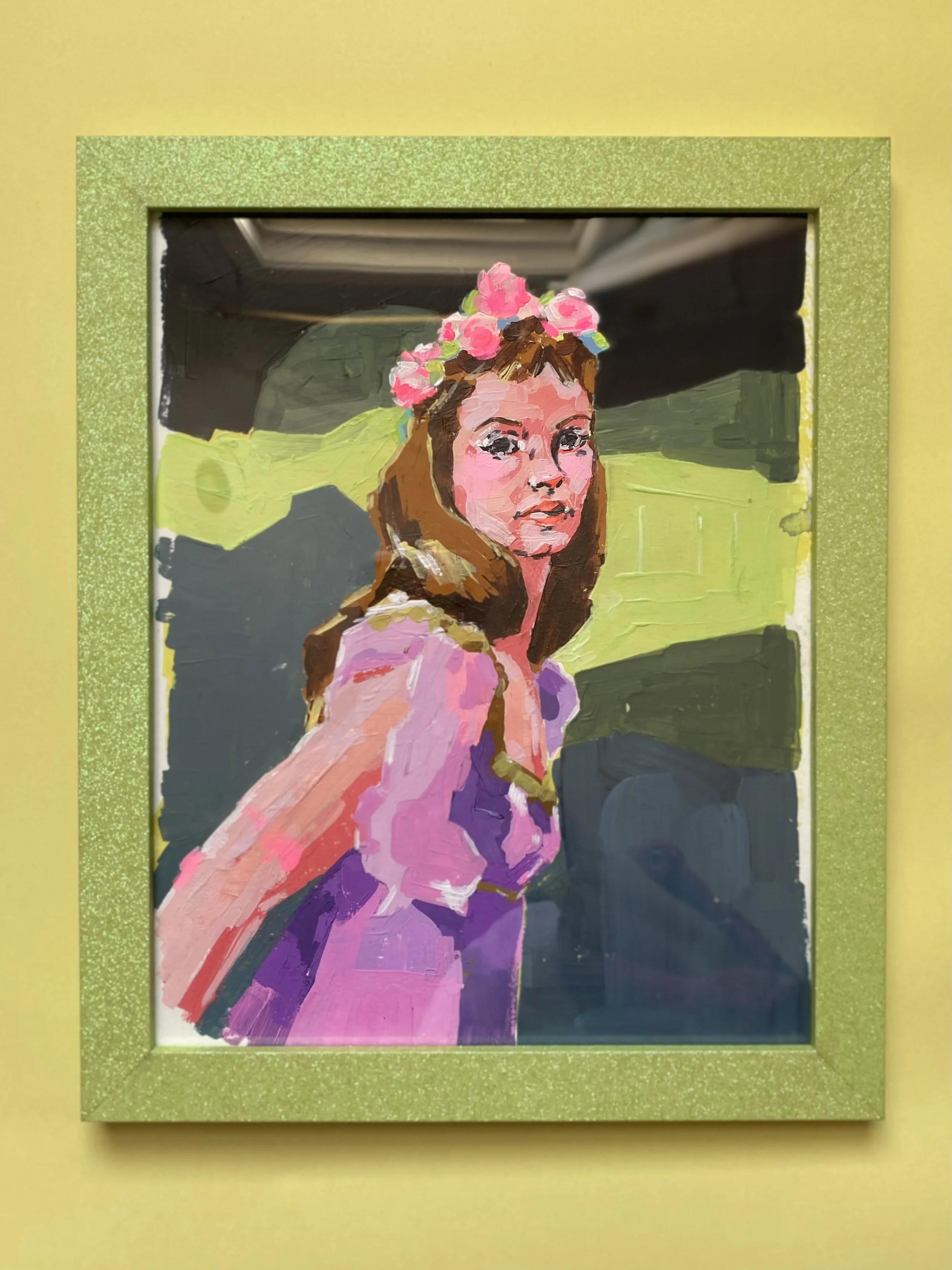 Painted portrait of a woman with brown hair and a pink floral crown, framed in a gold glittery border, against a green and black background.