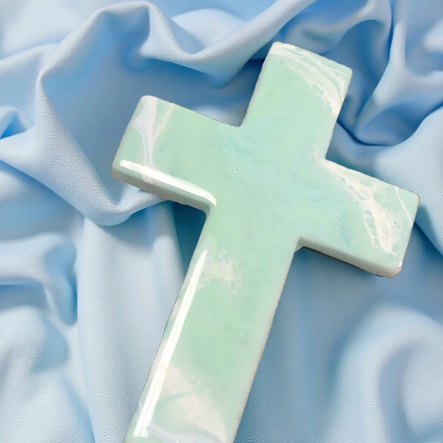 Presenting &lsquo;Serenity in Faith&rsquo;- a calming representation of peace and tranquility. The soothing greens and teals in this cross remind us of the serenity found in our relationship with God. Each piece is crafted with intention and love. 

