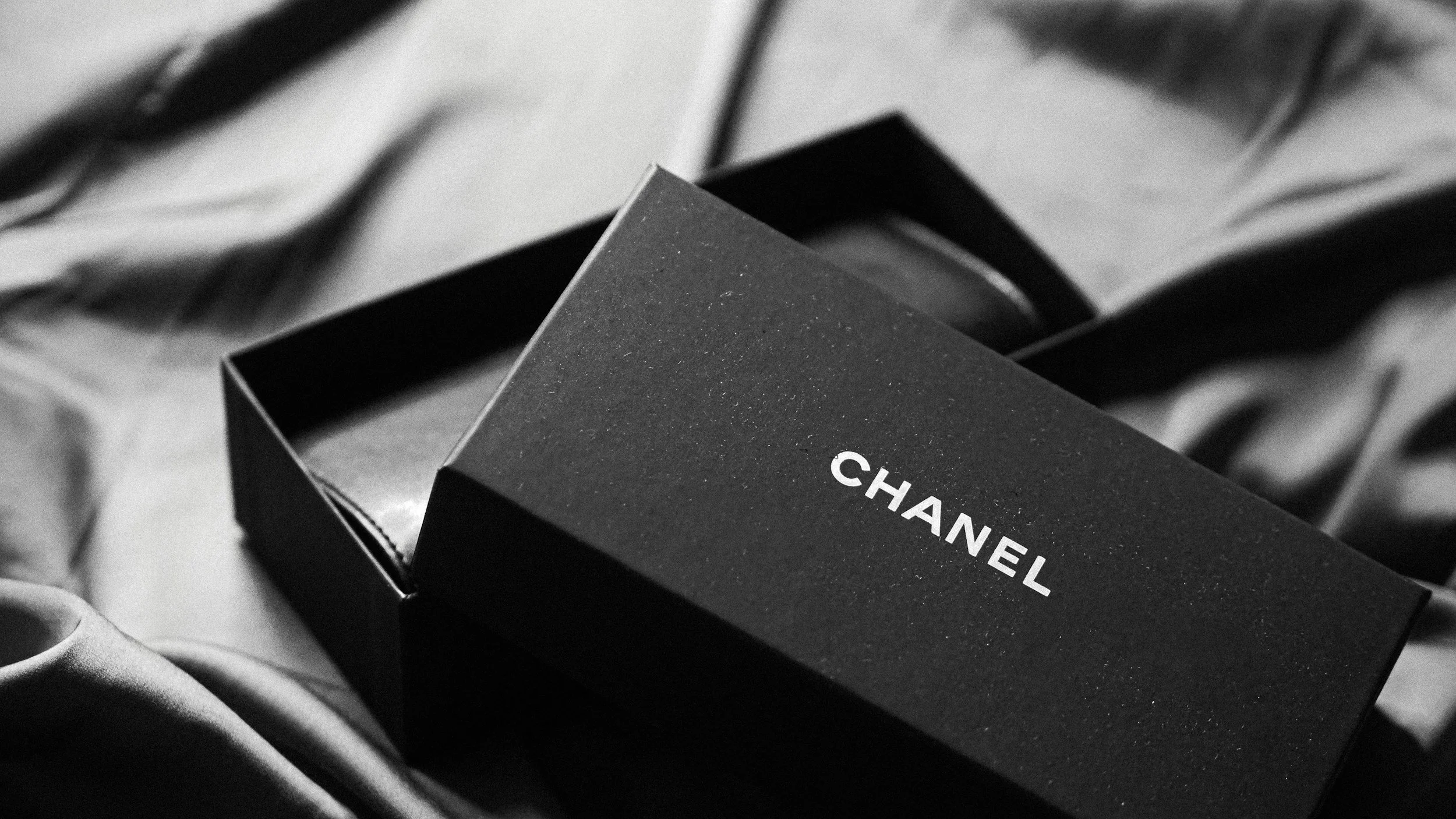 A black box with the brand name 'Chanel' written in white letters on it