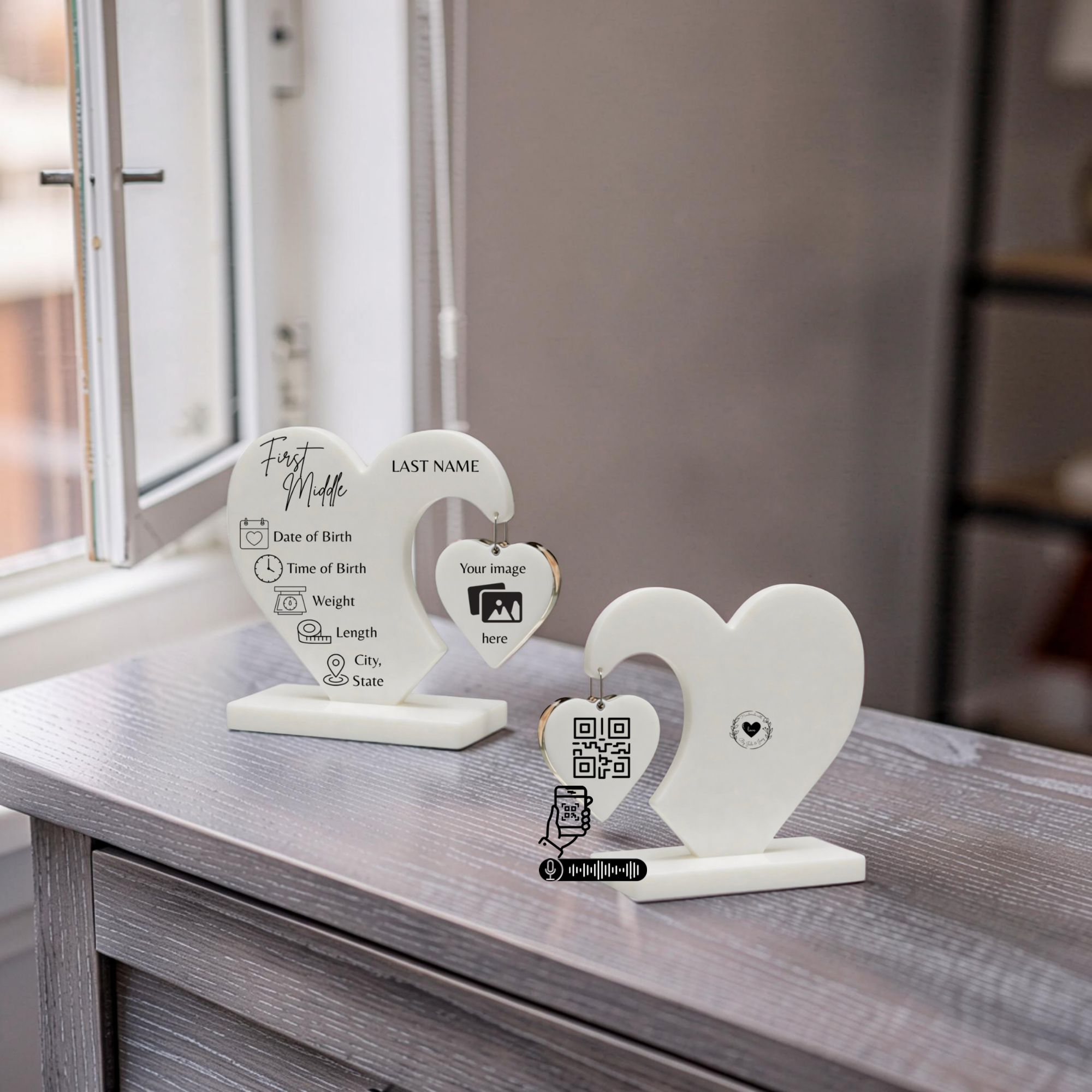 Decorative heart-shaped photo holder with labels for first name, last name, date of birth, time of birth, weight, length, city and state, along with a QR code and a barcode, displayed on a wooden surface near a window.