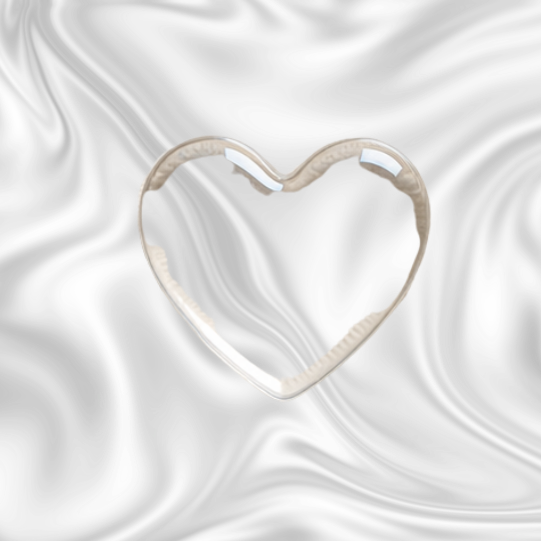 A heart-shaped outline cutout in a white material on a black swirling background.