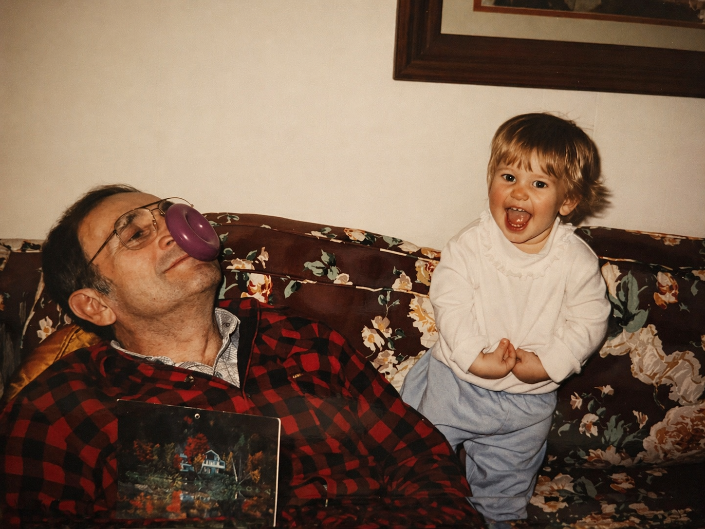 gvb founder as a baby playing with her grandfather on the couch in their house in Franklin, Tennessee