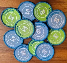 A collection of swimming social contact cards, mostly in green and blue colors, with the swimming society logo and text.