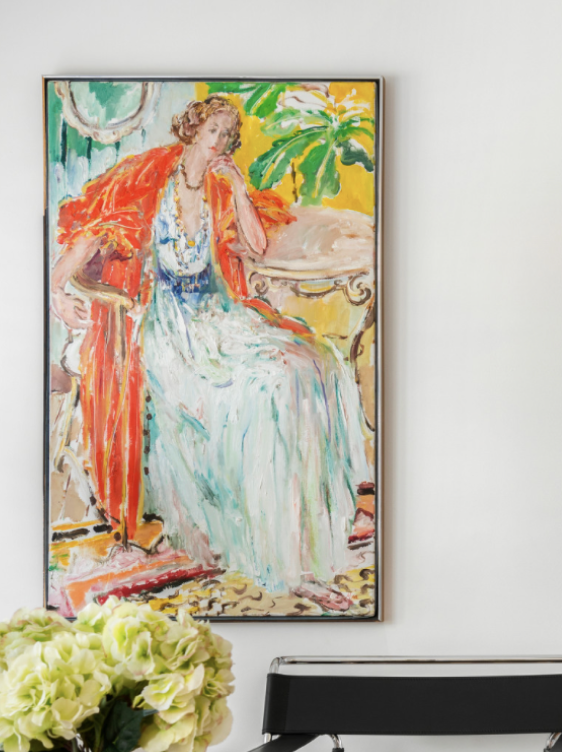 An impressionist painting of a woman sitting with a hand on her hair, wearing a flowing white dress and a red shawl, with a green plant in the background.