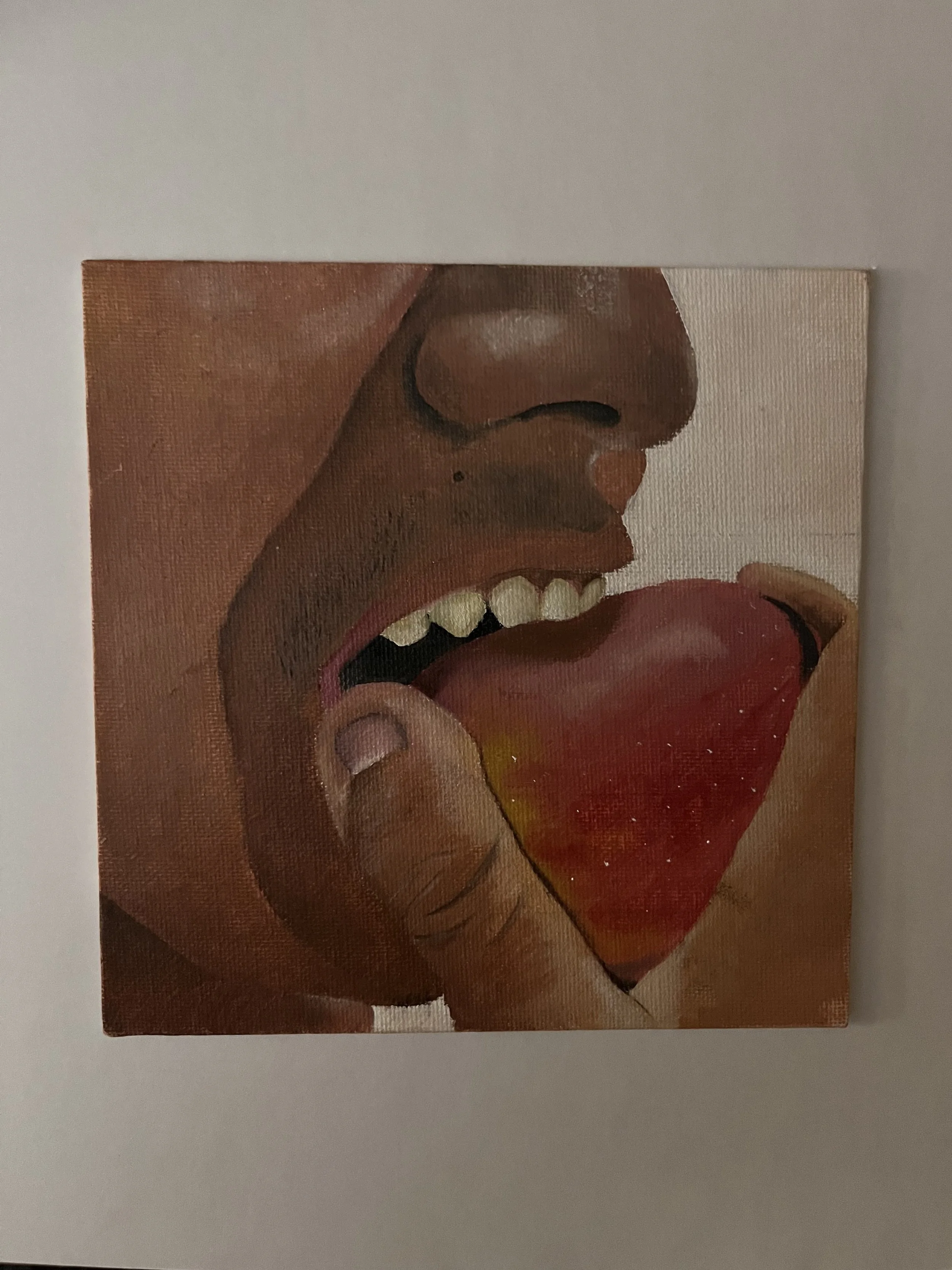 Close-up of a painting of a woman laughing with her mouth open, showing her teeth and tongue, with bold red lipstick and holding a red object near her lips.