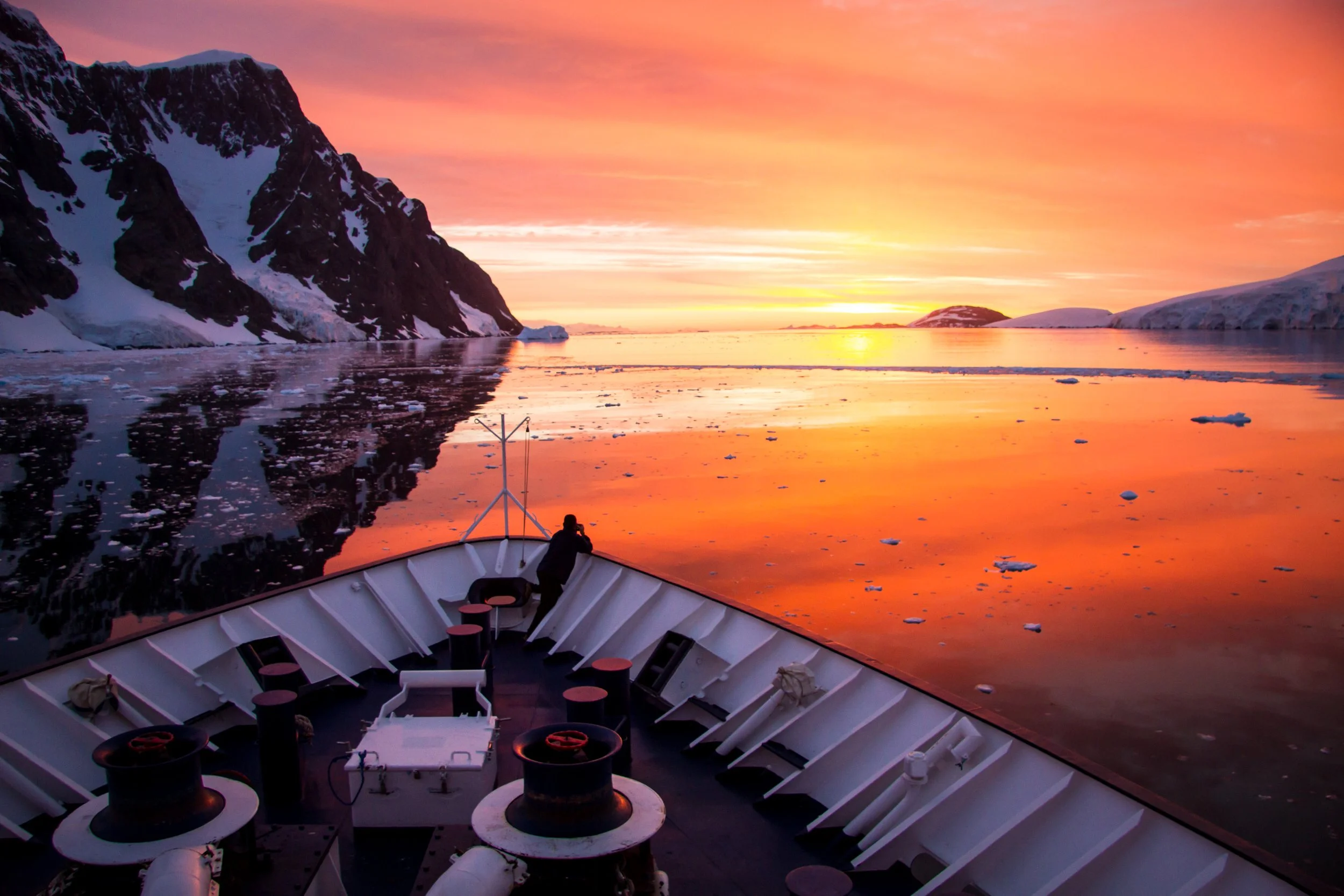 ANTARCTICA “Sea of Dreams” sunset on a calm Lemaire Channel  