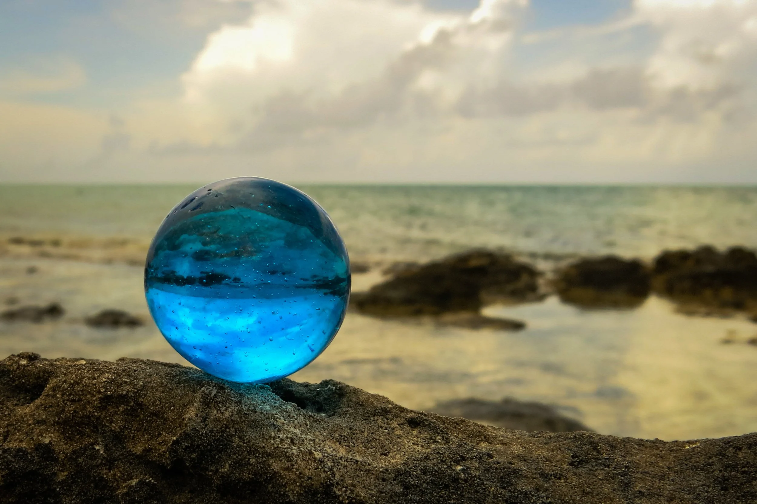 THE WORLD Earth the water planet is a blue marble glowing in the darkness of Outer Space