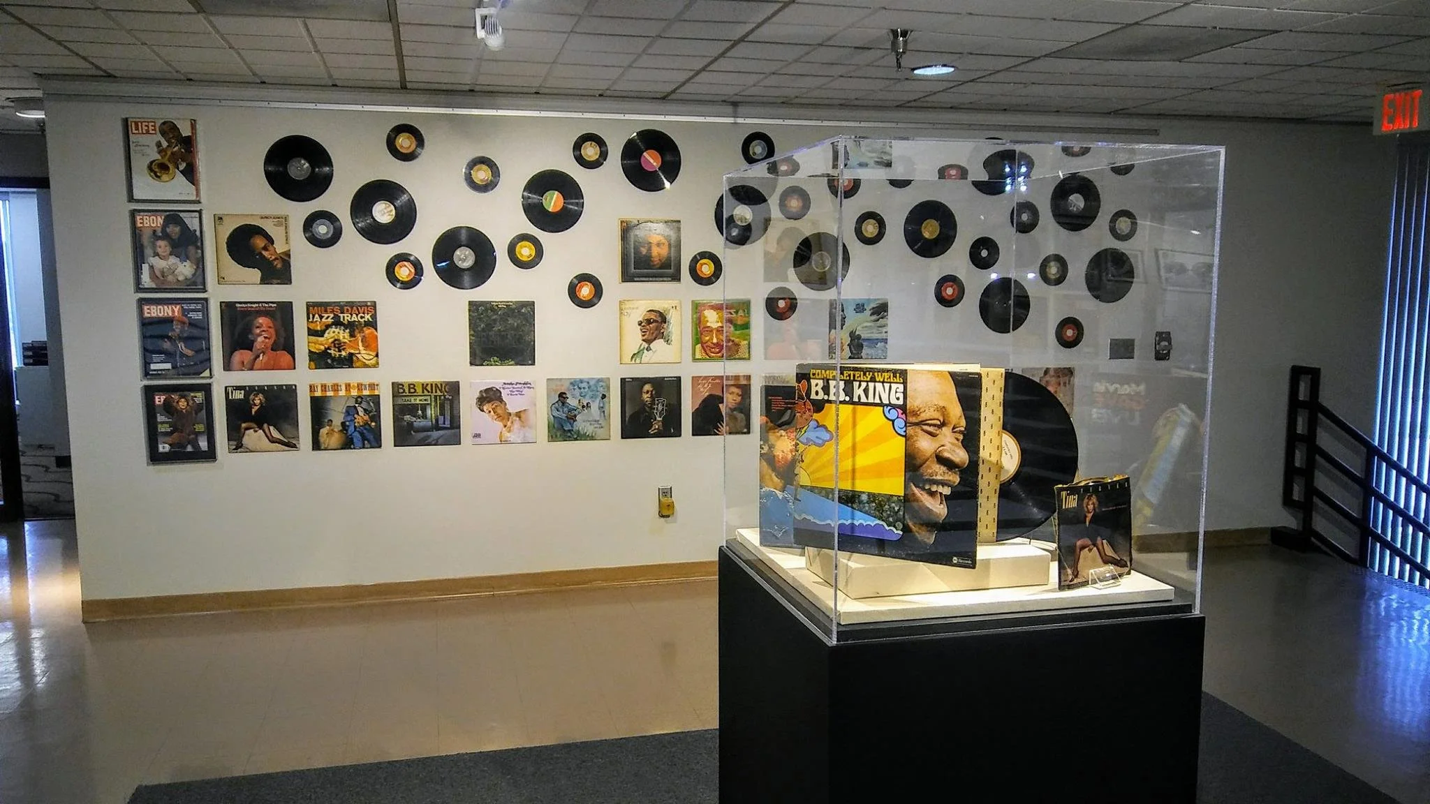 Music and culture exhibit featuring vinyl record albums and artifacts on display at the Bruce R. Watkins Cultural Heritage Center