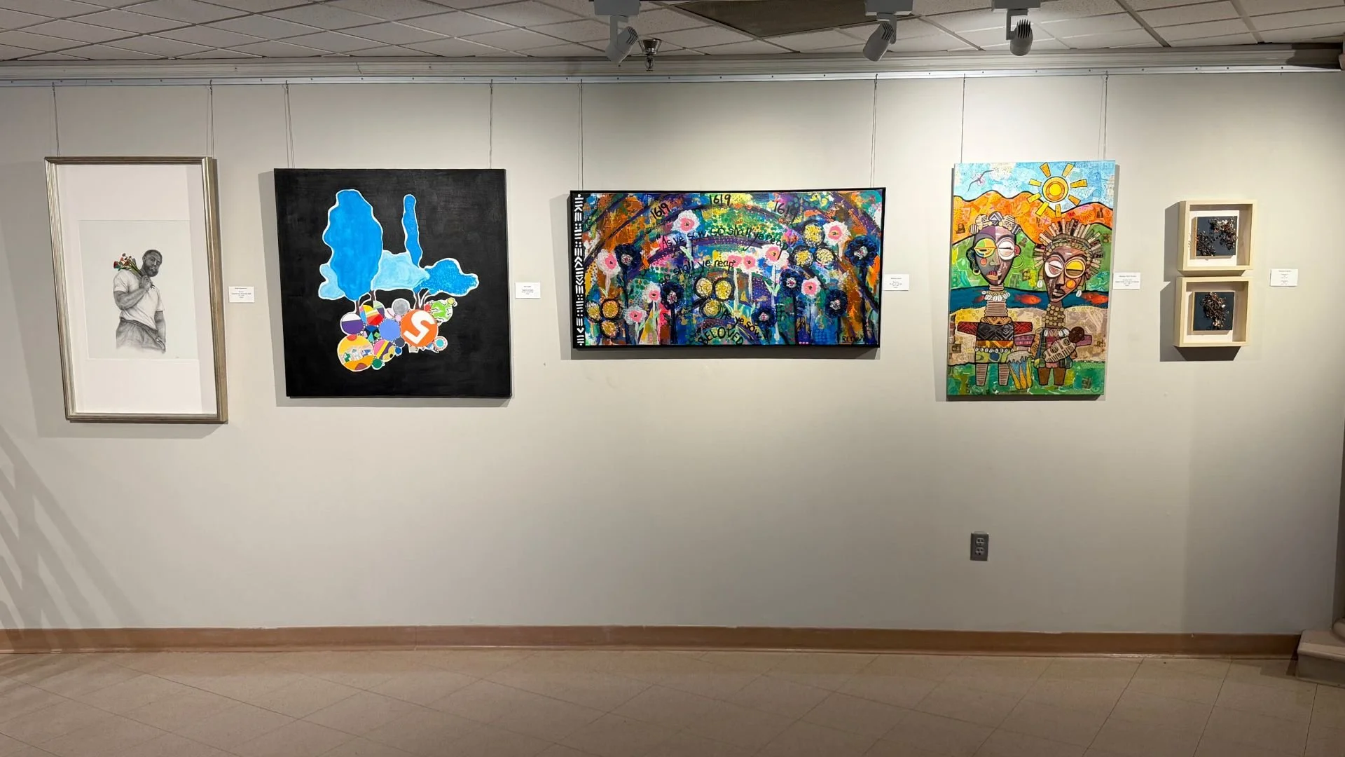 Gallery wall with five framed artworks featuring portraits, abstract shapes, colorful patterns, and mixed media pieces.