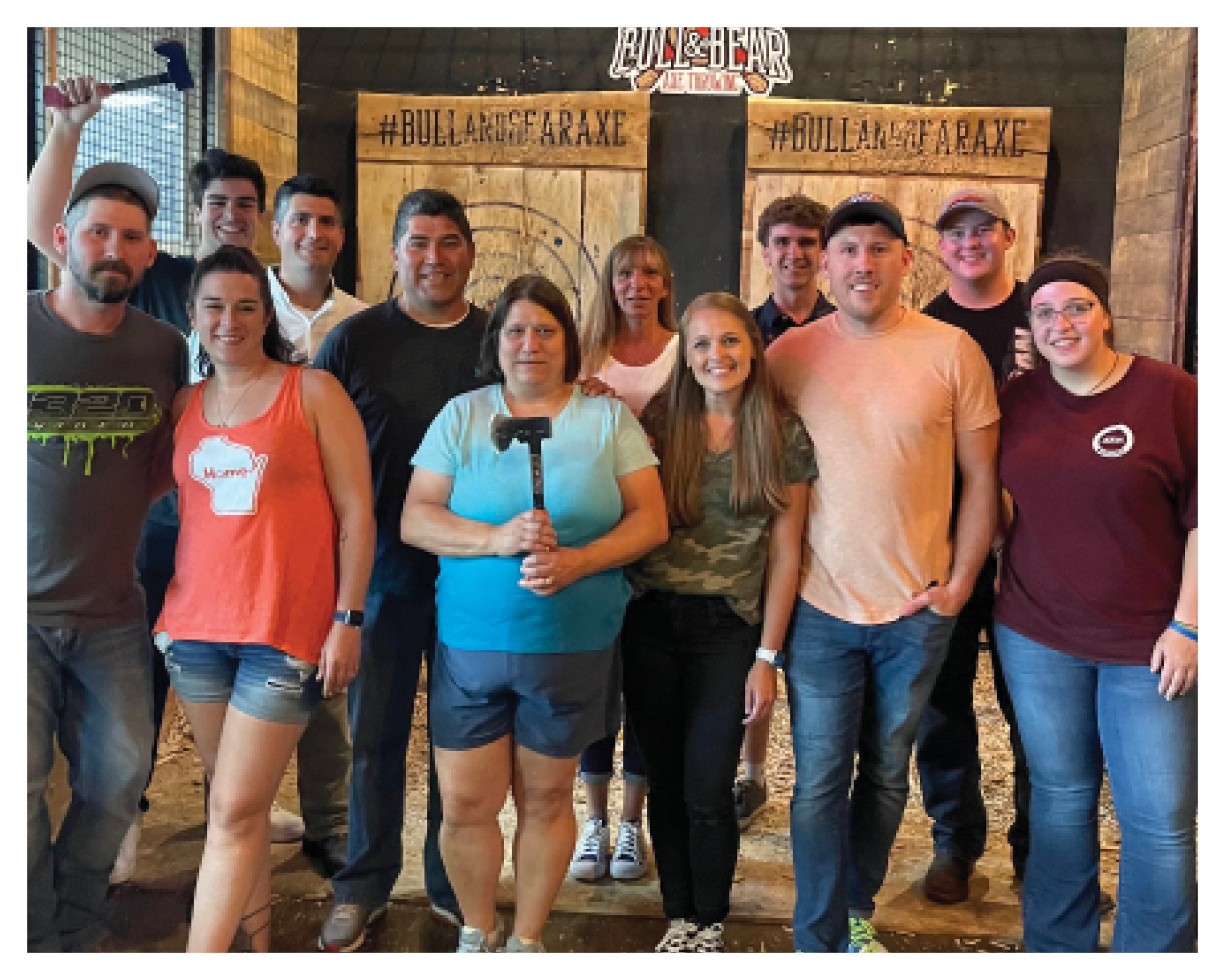 The First Place Rental team at an axe throwing event.