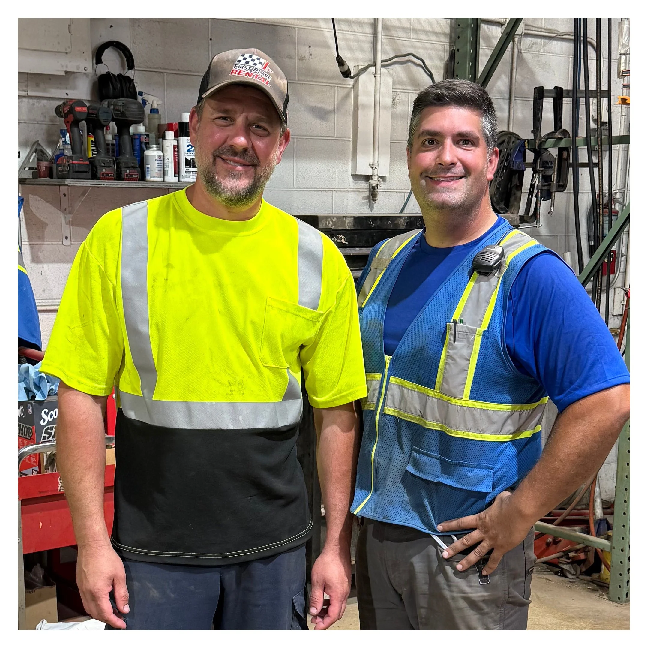 The in-house mechanic and Brian of First Place Rental.
