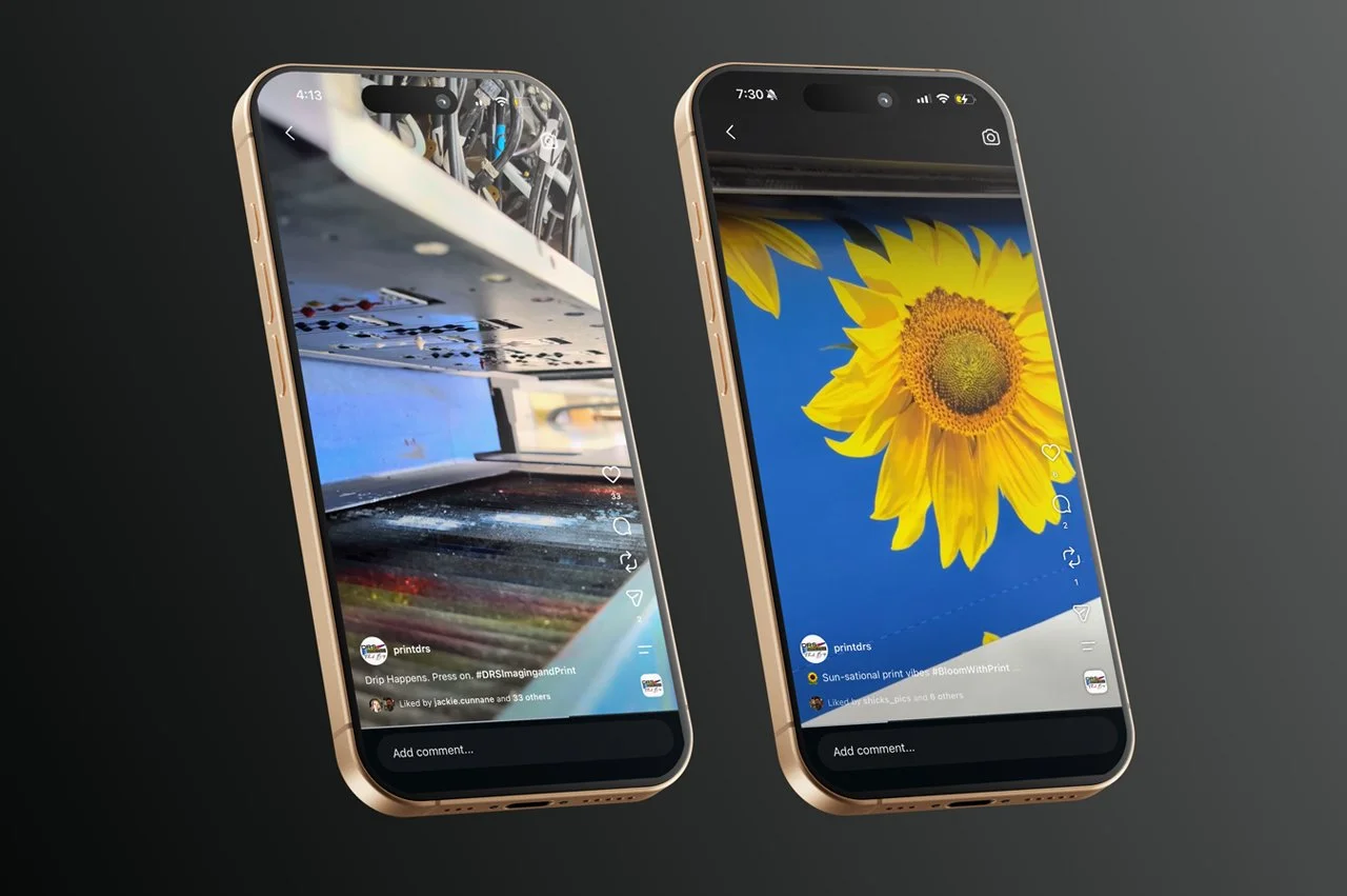 Two smartphones on a black surface showing DRS social media posts. The phone on the left displays a close-up of a printing machine, and the phone on the right shows a sunflower against a blue sky.