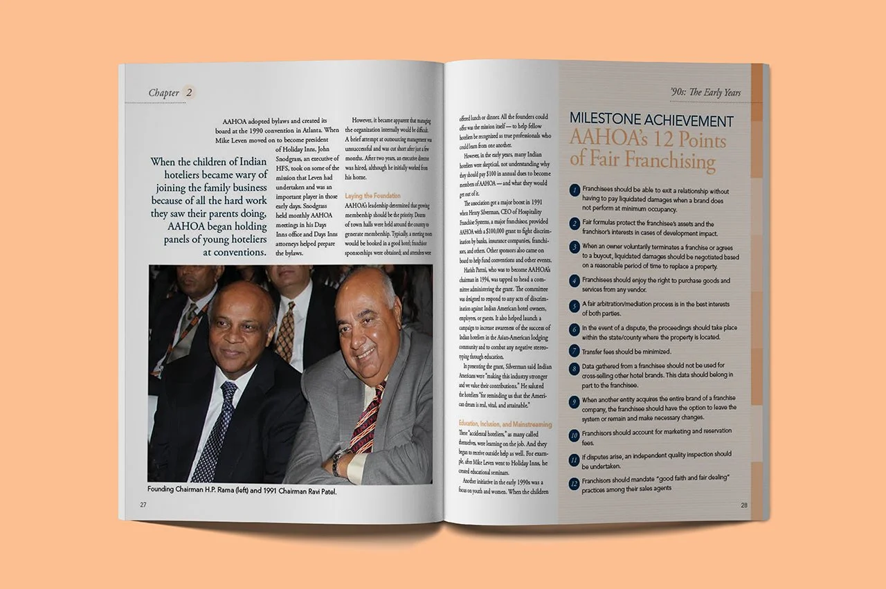 Open AAHOA book spread with a photo of two men in suits on the left page and an article titled 'Milestone Achievement AAHA's 12 Points of Fair Franchising' on the right page.
